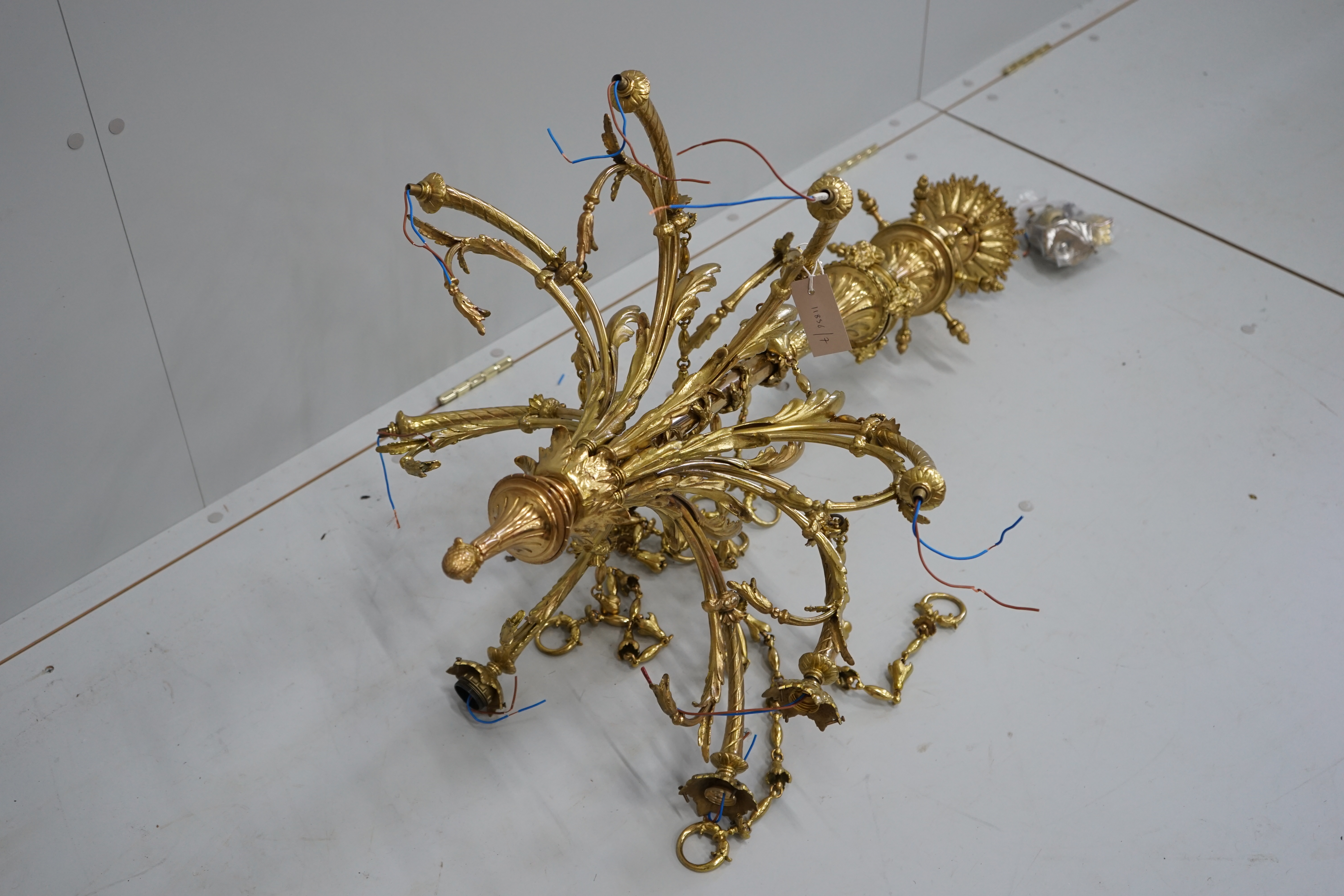 A gilt metal eight branch electrolier, height 106cm
